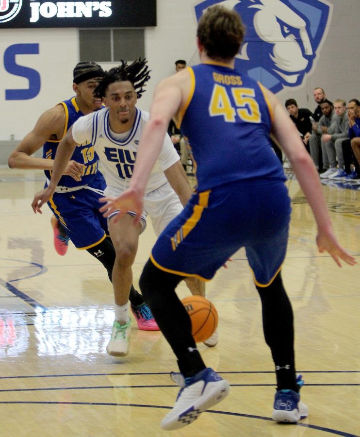Kinyon Hodges, a junior center dribbles past defenders during the mens basketball game against the Morehead State Eagles at Lantz Arena Wednesday afternoon. Hodges led the Panthers with 17 points and had four rebounds. The Panthers lost 69-63.