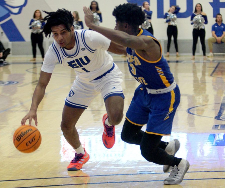 CJ Lane, a senior guard, dribbles past defenders during the mens basketball game against the Morehead State Eagles at Lantz Arena Wednesday afternoon. Lane scored three points and had one block. The Panthers lost 69-63.