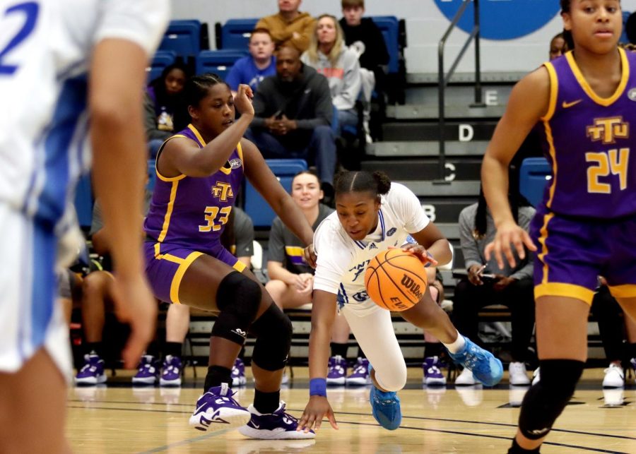 Taris Thornton (25), a sophomore forward, falls while controlling the ball and being pressured by defenders during the womens Senior Day basketball game against the Tennessee Tech Golden Eagles at Lantz Arena Saturday afternoon. Thornton scored seven points. The Panthers lost 66-61.