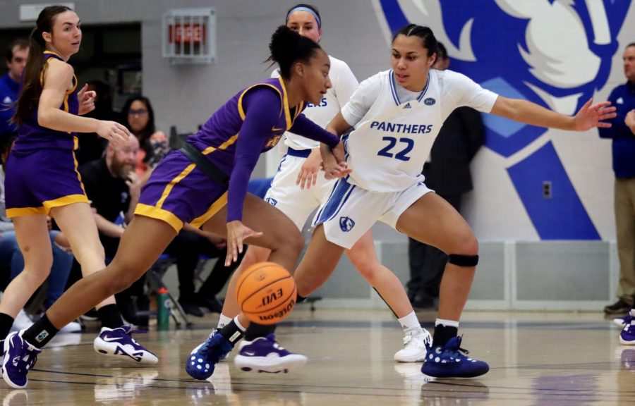 Lariah Washington (22), a senior guard, sticks with attackers playing defense during the womens Senior Day basketball game against the Tennessee Tech Golden Eagles at Lantz Arena Saturday afternoon. Washington scored 13 points and had four assists.