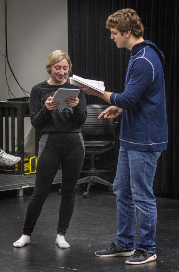 From left, Becca Geffs (Kira), a junior music education major, runs through lines with Mitchell Cox (Danny, Zeus), a freshman theater major, during rehearsal.