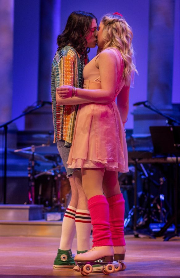 Becca Geffs (Kira), a junior music education major, kisses Benjamin Woolery (Sonny), a freshman theatre major, during the first dress rehearsal of Xanadu Sunday evening in the Theatre.