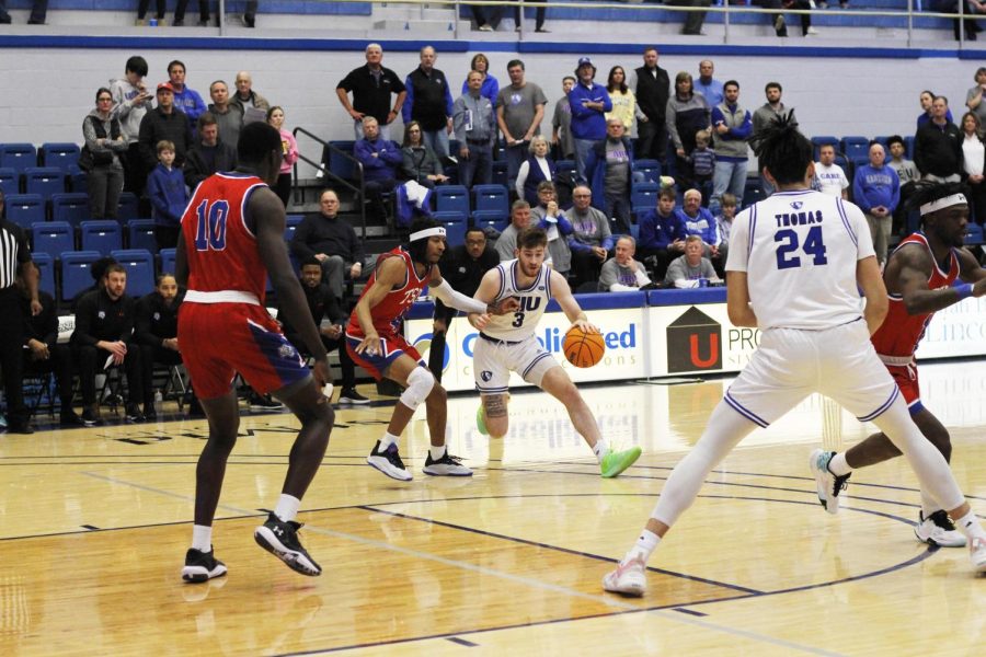 Eastern guard, Cameron Haffner (3), dribbles towards the basket, avoiding Tennesse State guard, Jr. Clay (4), before attempting to shoot the ball in Lantz Arena on Saturday afternoon.