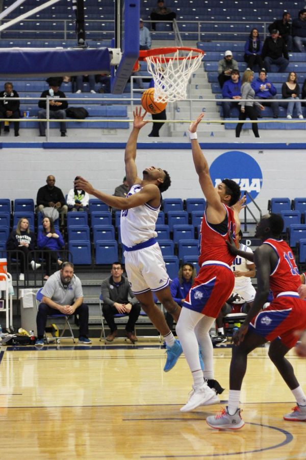 Eastern guard, Caleb Donaldson (20), jumps up in attempts to make a basket, while Tennessee State forward, David Acosta (44), attempts to block Donaldsons shot in Lantz Arena on Saturday afternoon.