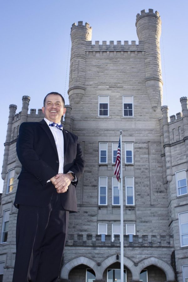 Jay Gatrell poses for a picture in front of Old Main after being announced as the 13th president of Eastern Illinois University Friday afternoon.