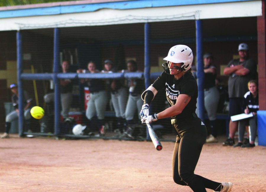 Outfielder, Morgan Lewis, attempts to bunt the ball at an exhibition game against Olney Community College at Williams Field.