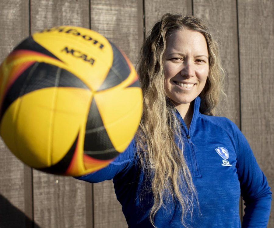 Sara Thomas, the volleyball coach, poses for a picture.