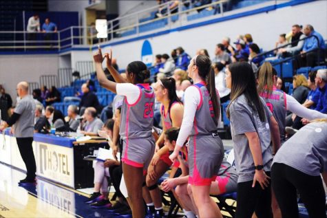 Eastern forward, Taris Thornton (25), holds up a W with her hands, as the game ends, resulting in Easterns 12th win of the season, breaking their Best Start in the OVC record in Lantz Arena on Saturday afternoon.