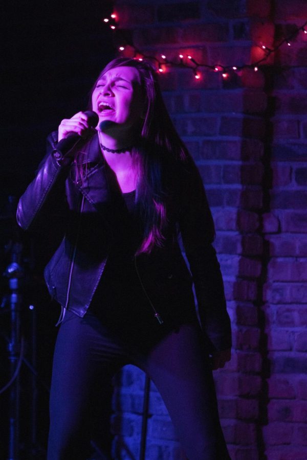 Emily Thorpe, a junior music performance major, performs with her band, Absent Ground, Friday night in 7th Street Underground in Martin Luther King Jr. University Union.