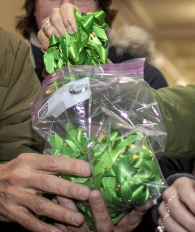 Union members encouraged participants and supporters to wear green ribbons to show comradery in the contract negotiations after delivering the strike intention letter Monday afternoon.