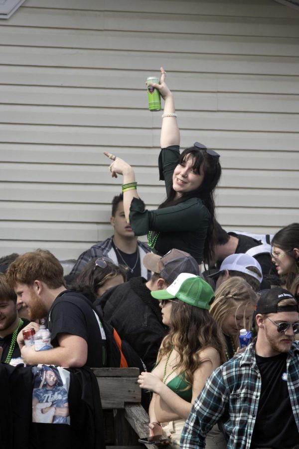 A partygoer dances on the balcony of the second Unofficial party house Saturday morning.