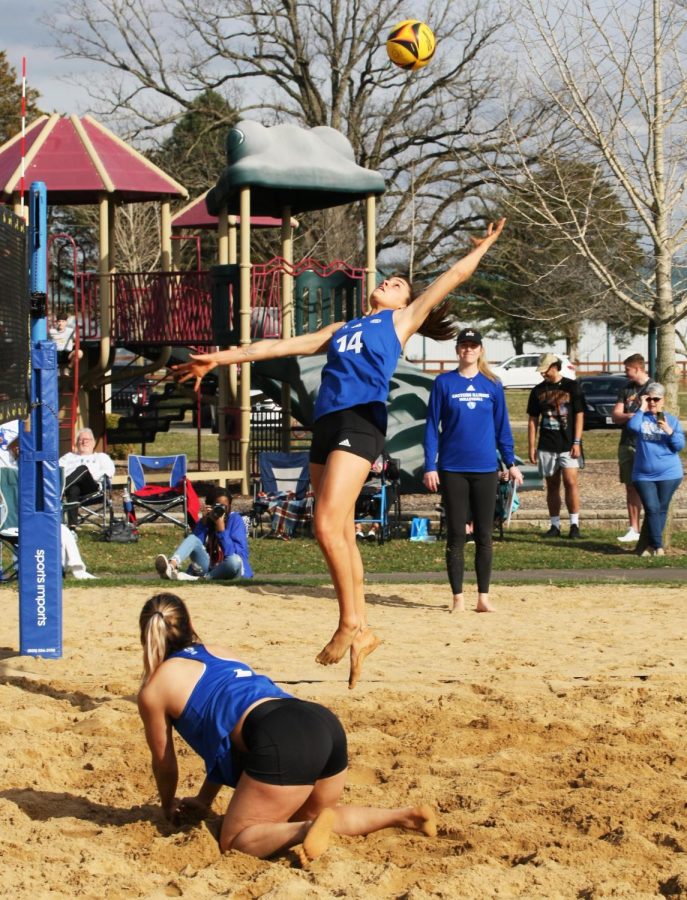 Eastern beach volleyball player, Lilli Amettis, attempts to jump up and save the ball from touching the ground after a diving save from Christina Martinez Mundo Monday afternoon in Sister City Park. The Panthers lose 3-2.