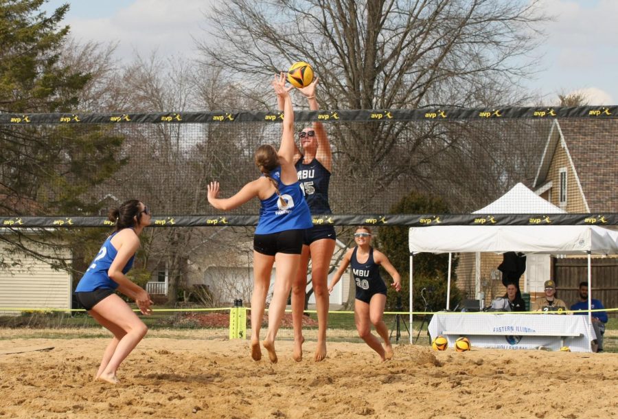 Eastern beach volleyball player, Catalina Rochaix, attempts to block the ball from going over the net after a Missouri Baptist player attempts to hit it over on Monday afternoon in Sister City Park. The Panthers lose to the Spartans 3-2.