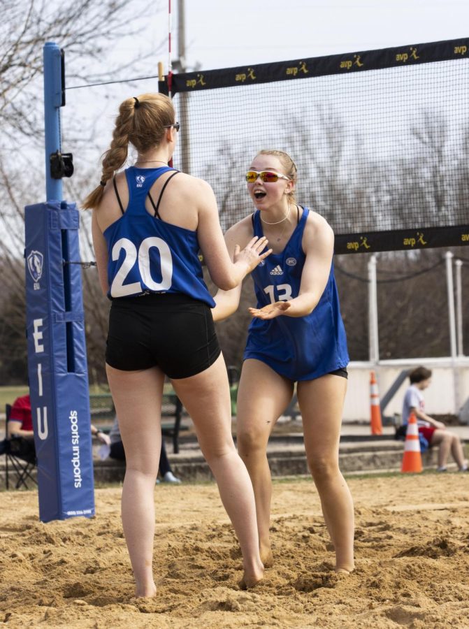 At their first beach volleyball match of the season against Missouri Baptist University, Emily Wilcox and Ella Collins congratulate each other after winning points Monday afternoon at Sister City Park. The Panthers lost 2-3 against the Spartans.