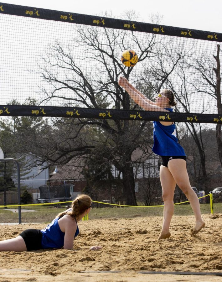 Emily Wilcox attempts to bump the ball over the net at the beach volleyball match against Missouri Baptist University. The Panthers lost 3-2 against the Spartans Monday afternoon in Sister City Park.