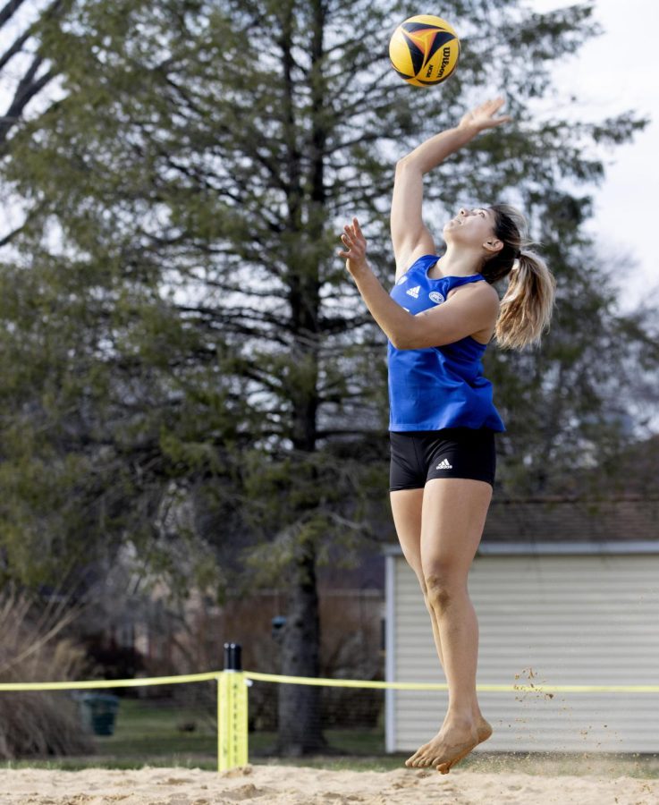 Christina Martinez Mundo attempts to spike the ball over the net at the beach volleyball match against Missouri Baptist University Monday afternoon in Sister City Park.