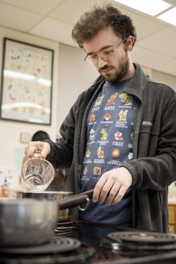Dawson Rhoads, a graduate nutrition and dietetics major, attends the Cooking Thyme: Noodles and Company class presented by the Health and Counseling Services in Klehm Hall.