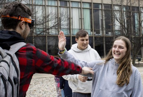 While wearing goggles that make you see everything as if one were drunk, Lucas Cohen, a senior finance major, tries to give Kylee Backer, a junior special education major, a high five, but misses due to his temporary impairment. The darty event was hosted by student government on the Library Quad Thursday afternoon.