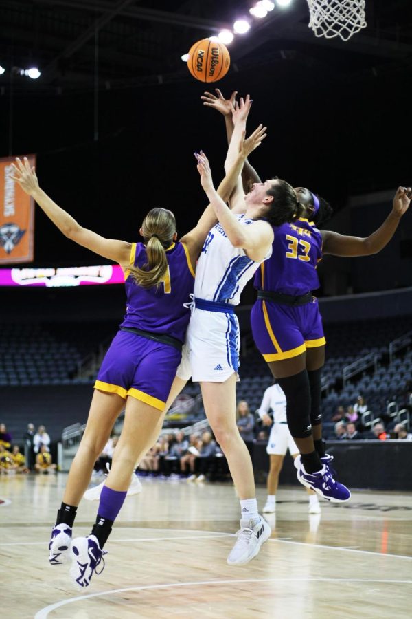 Eastern forward, Macy McGlone (33), attempts to keep possession of the ball after a pass from a teammate, while two Tennessee Tech players attempt to double-team her and steal the ball at the Ohio Valley Conference Tournament Friday afternoon. The Panthers lost 61-66 to the Golden Eagles. 