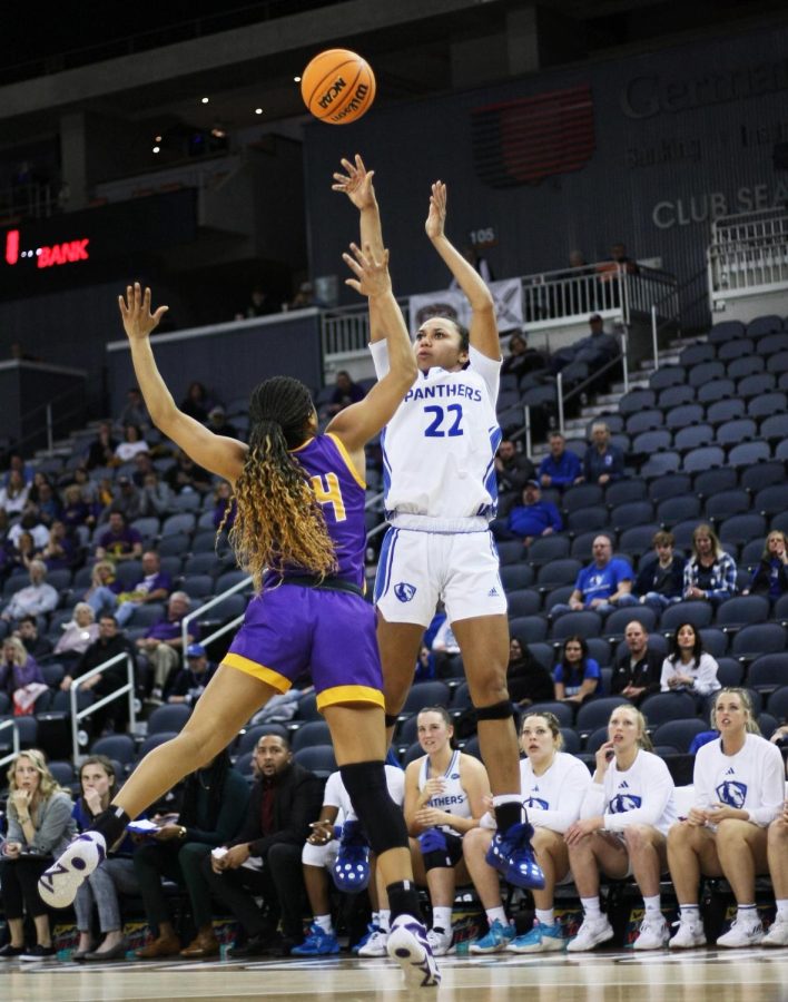 Eastern guard, Lariah Washington (22), attempts a 3-pointer while a Tennessee Tech player attempts to block her shot at the Ohio Valley Conference Tournament Friday afternoon. The Panthers lost 61-66 to the Golden Eagles.