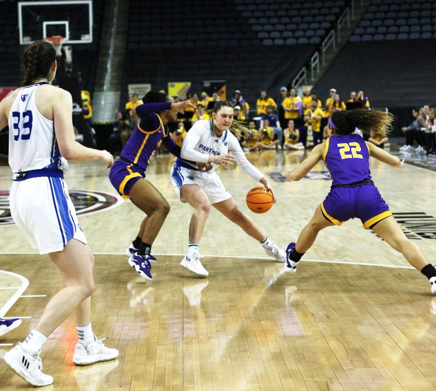 Eastern forward, Morgan Litwiller (24), attempts to keep position of the ball while two Tennessee Tech players attempt to double-team her to steal the ball at the Ohio Valley Conference Tournament Friday afternoon. The Panthers lost 61-66 to the Golden Eagles.