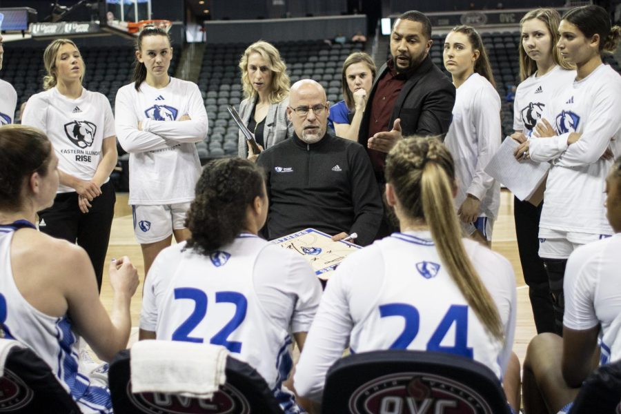 During a timeout, the EIU womens basketball team go over plays with Matt Bollant, the head coach and Marcus McGlothan, the assistant coach at the Ohio Valley Conference Friday afternoon.