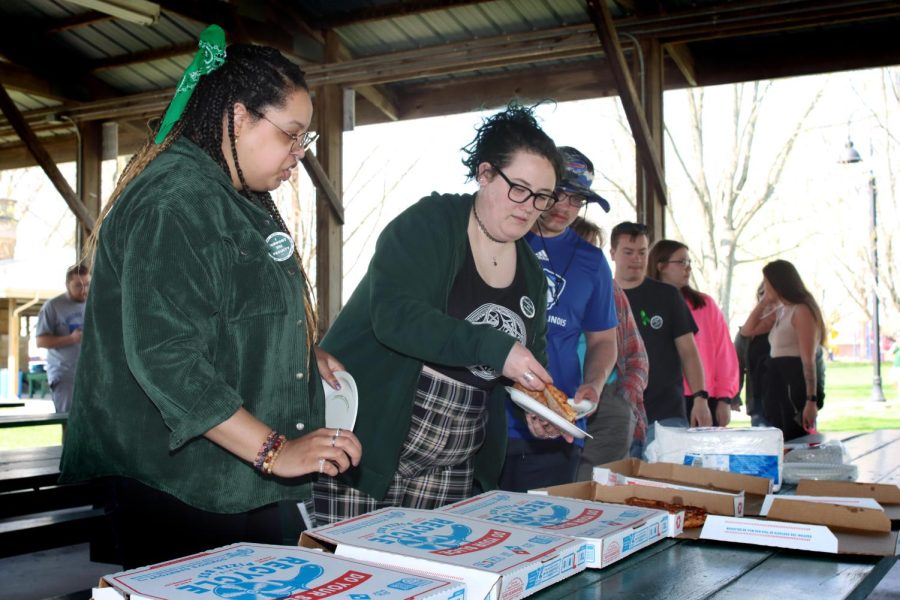 Dozens of students ate Dominos pizza at the Student and Community Day morning session at Morton Park Wednesday.
