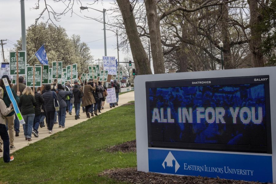 Members of the Eastern Illinois University chapter of the University Professionals of Illinois chant about what they want in a new contract during their strike at Old Main.