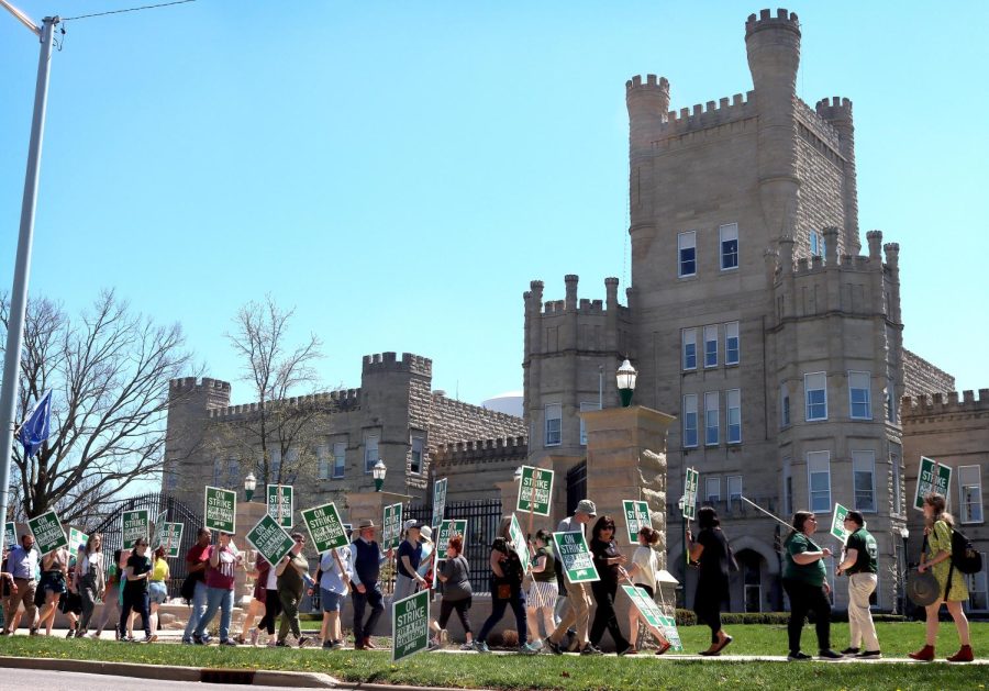 EIU-UPI and student picketers walk outside Old Main on their fourth day of picketing for a fair contract Tuesday morning.