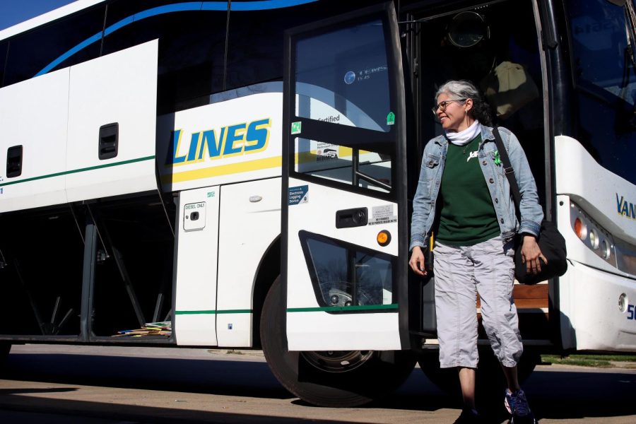 Juanita Cross, an academic adviser and member of EIU-UPI, gets off the charter bus that the union took to support Governors State Universitys UPI union on their first day of picketing Tuesday afternoon.