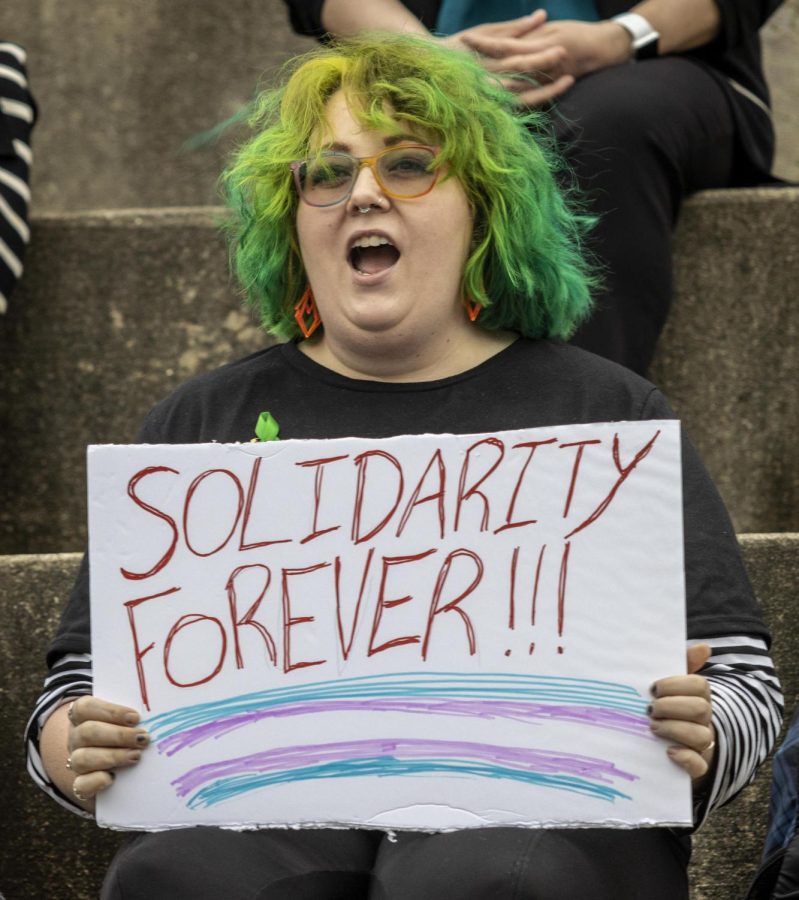 Corey Cunningham, an on-campus counselor, yells chants about transgender unity. Cunningham said this cause is near and dear to her heart because she has loved ones and clients who are trans. It was impartive for me to show up and give support, 