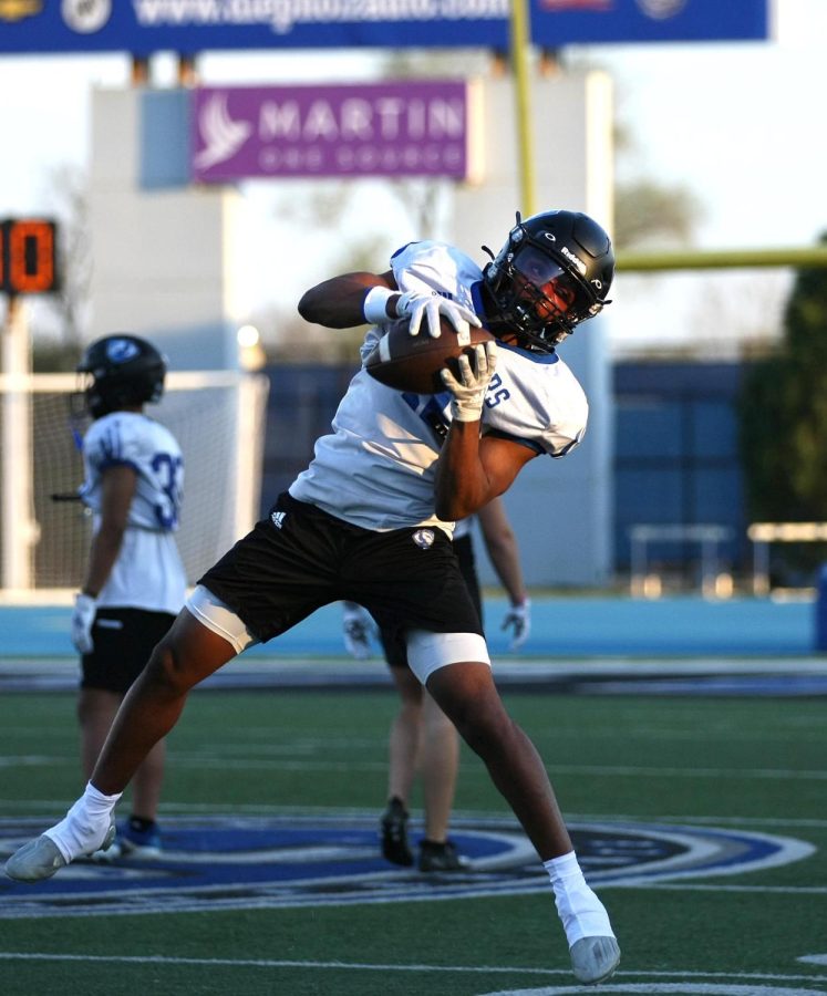 Eastern running back, Lazerick Eatman (36), catches the ball during a drill during one of their spring practices on the OBrien Field Tuesday evening.