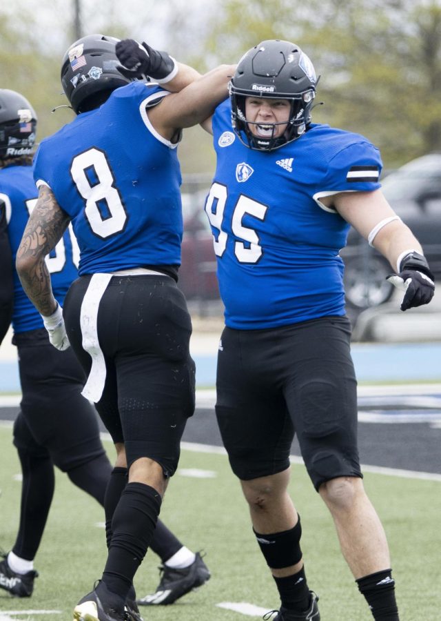 Defensive back Tienne Fridge and defensive lineman Cole Silzer celebrate with each other during their spring football scrimmage Saturday afternoon on the OBrien Field.
