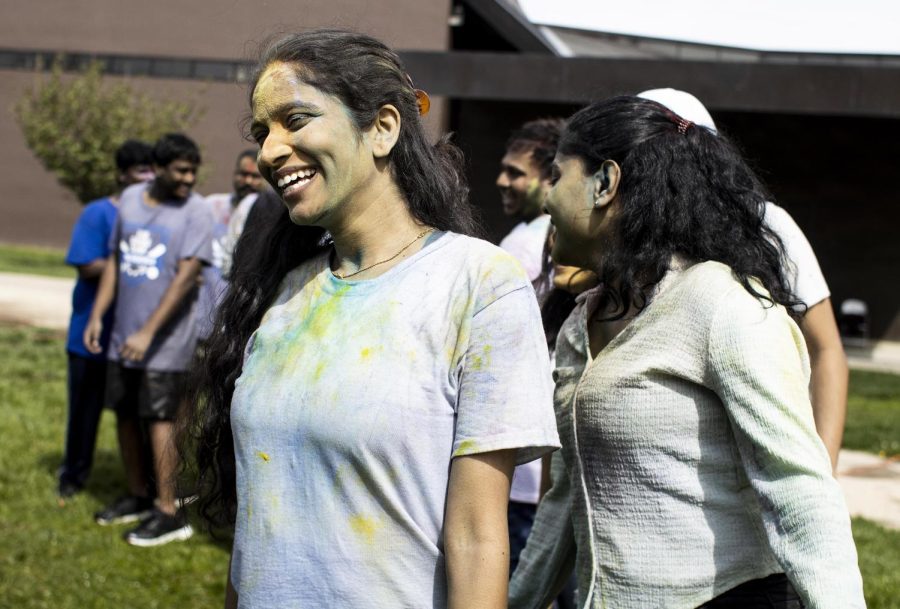 Sripooja Rangineni, a computer technology graduate student, dances to music with her friends during the Holi celebration on the Library Quad Friday afternoon.