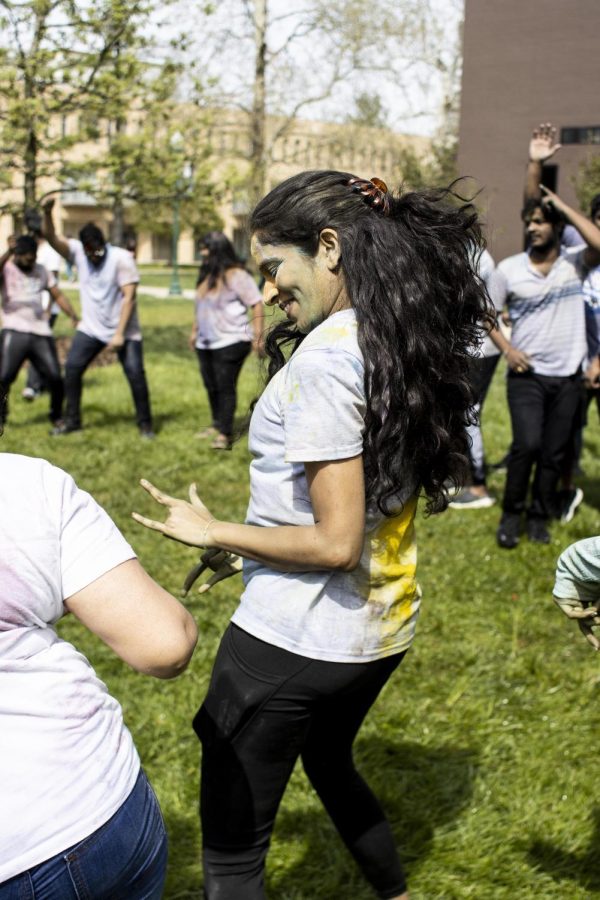 During the Holi celebration Sripooja Rangineni, a computer technology graduate student, has fun dancing with others who also celebrate the holiday on the Library Quad Friday afternoon.