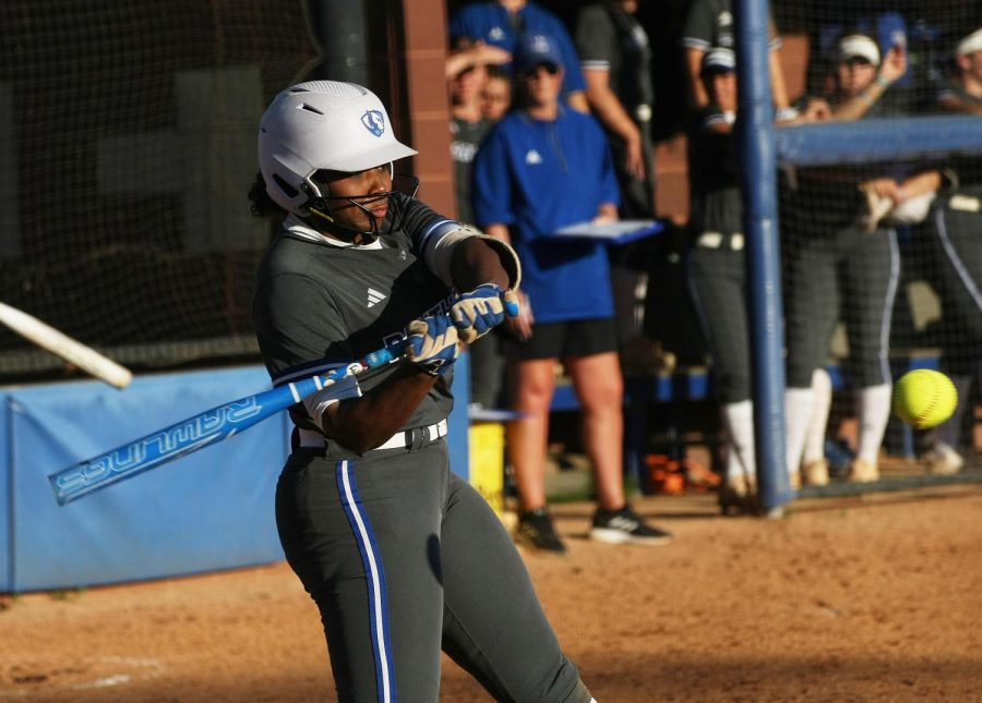 Sophomore infielder/outfielder Aniya Holt (9), swings at a pitch from a St. Louis University pitcher, during their game Wednesday evening. The Panthers won 4-3. 