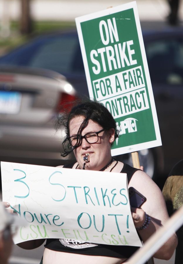 Community members joined professors striking at the picket line Wednesday afternoon in front of Old Main.