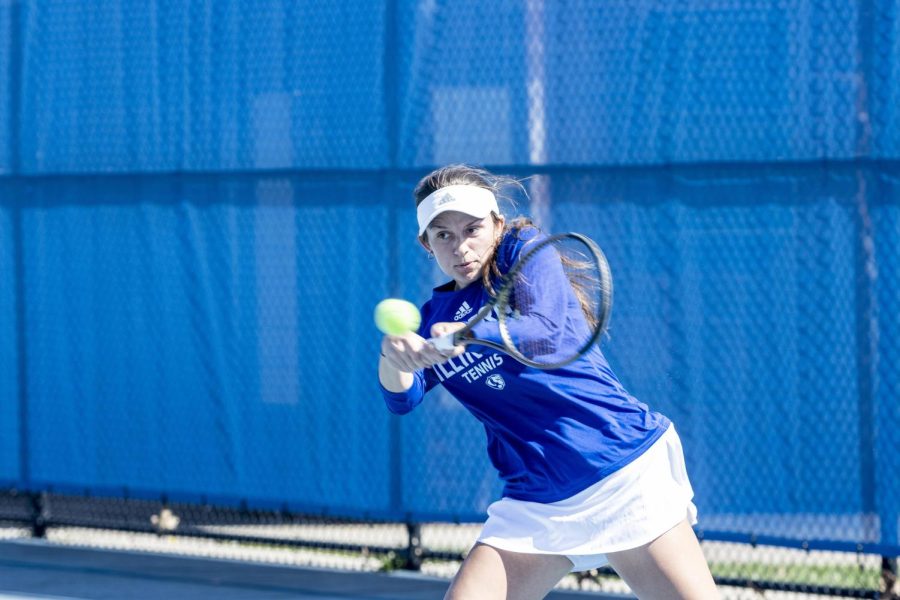 Senior Lauren Ellis hits the ball back across the net during her singles match against Southern Illinois University Edwardsville Saturday afternoon at the Rex Darling Courts. Ellis wins her singles game against Cougar Fabiola Perez while the Panthers lose 5-2 overall to the Cougars.