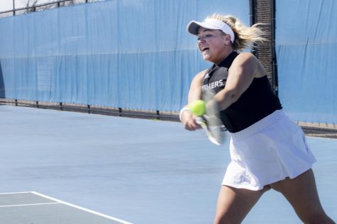 Junior Addison Brown plays doubles vs Southern Illinois University Edwardsville on the Rex Darling Courts Saturday afternoon. Brown loses in her doubles match against the Cougars 6-1.