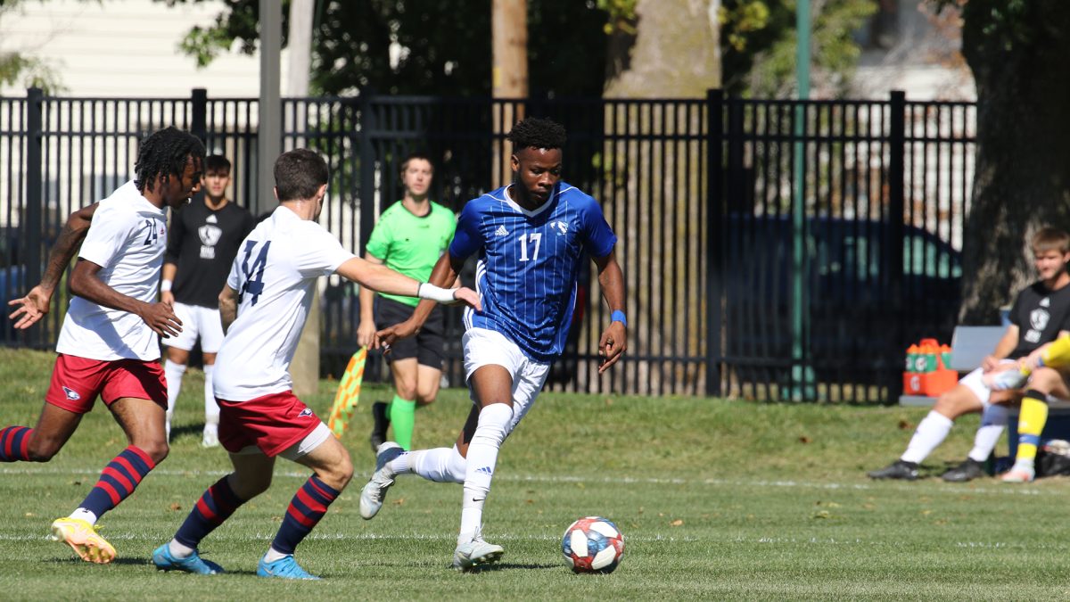 Lesego Maloma (17), a junior forward dribbles the ball away from defenders to try to get a shot during the game against Southern Indiana University Eagles on Saturday, Oct. 1 2022, at Lakeside Field.  The Panthers lost 3-2 against the Eagles.