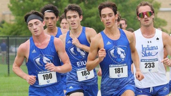 Sophomores Mason Stoeger (190) and Michael Atkins (181) run during the Walt Crawford Open meet at the Panther Trail during the 2022 season.