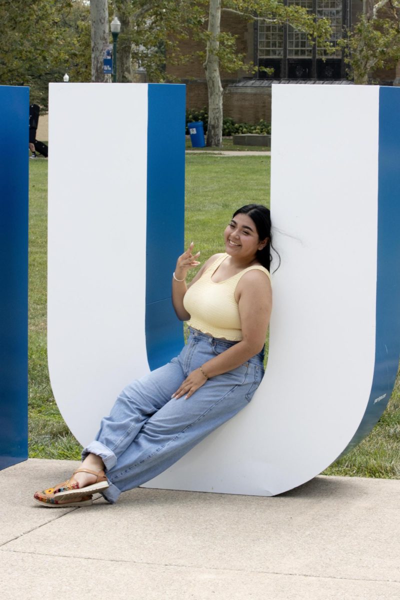 Amairany Bueno Benitez, a junior marketing major poses at Easterns First Day of Class Photos at the Library Quad.