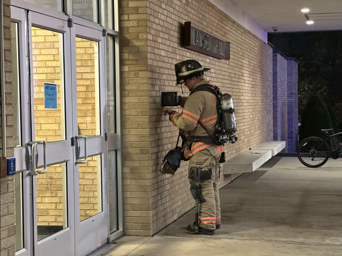 Firefighter using the Knox system on Tuesday, Sept. 5. outside of Lawson Hall at Eastern Illinois University in Charleston, Ill.