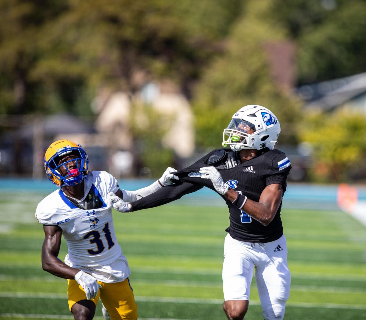 Sophomore wide receiver Justin Bowick jr. (1) attempts to catch the football being thrown at O‘Brien Field Saturday afternoon.