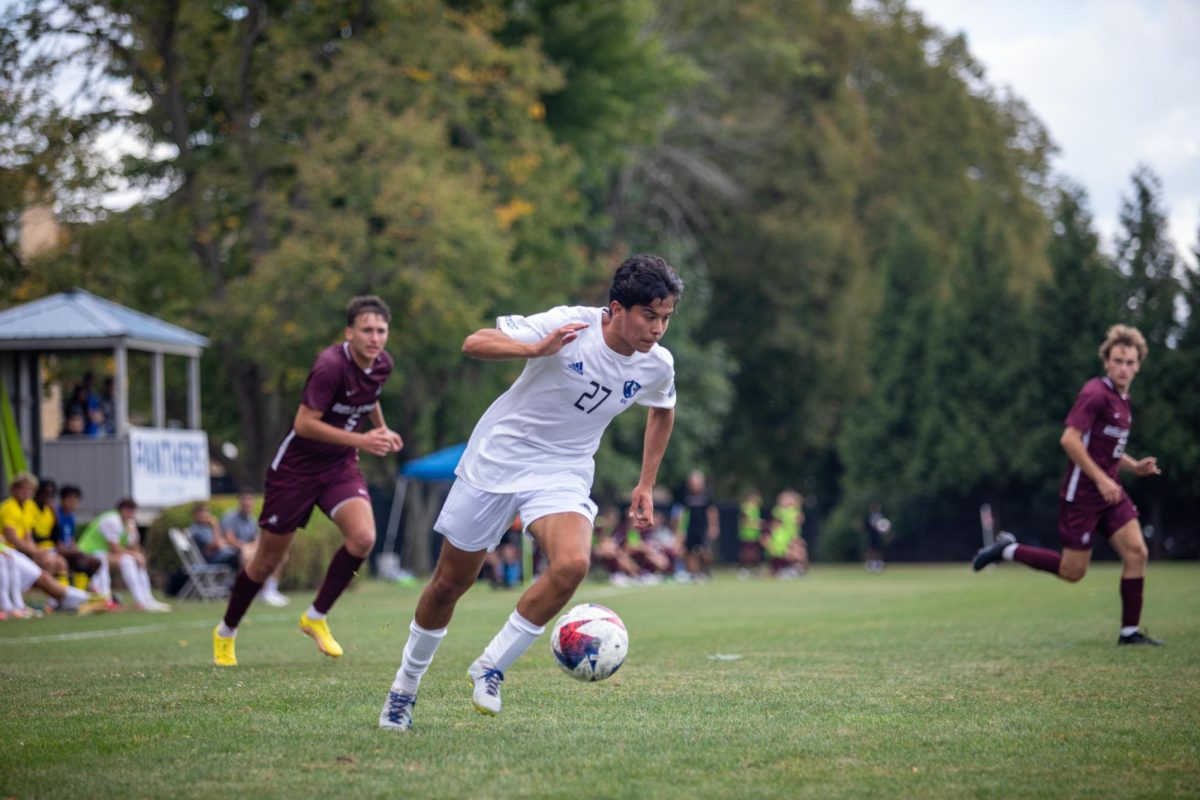 Jared Cornejo, a junior biological science major, dribbles the ball towards Bellarmine goal at Lakeside Field Saturday afternoon