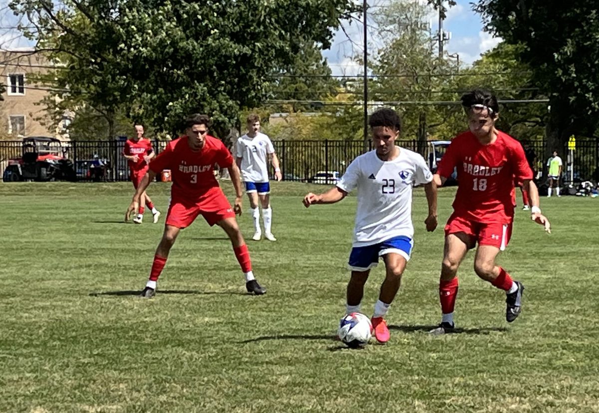 Julian Smith dribbles between Bradley University defenders on Sunday, Sept. 3 2023 at Lakeside Field on Eastern Illinois Universitys campus in the afternoon. (Luther Yoder 2023)