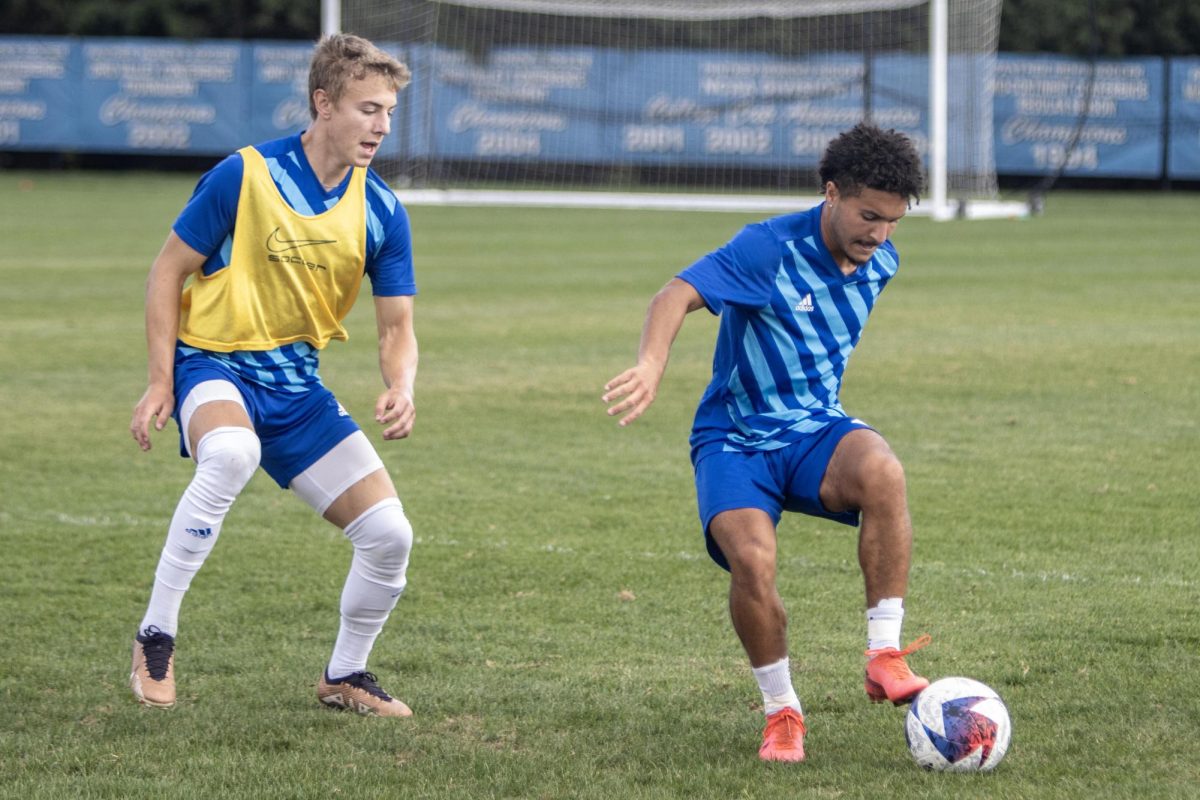 Senior forward Julian Smith tries to get past freshman forward Jeffery Rinker II.