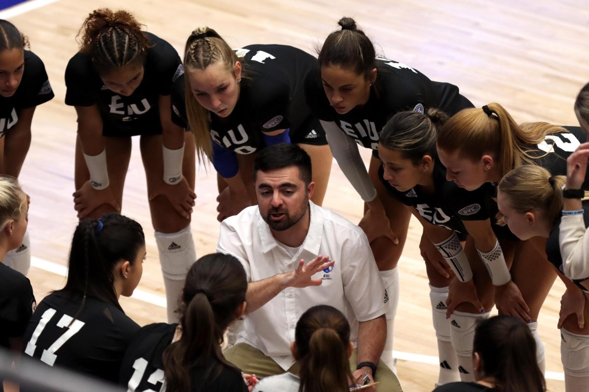 Associate Head Volleyball Coach Cole Aiazzi, speaks with the team during a timeout during the volleyball game against the University of Missouri Tigers Friday afternoon at Lantz Arena. The Panthers lost 3-1. 