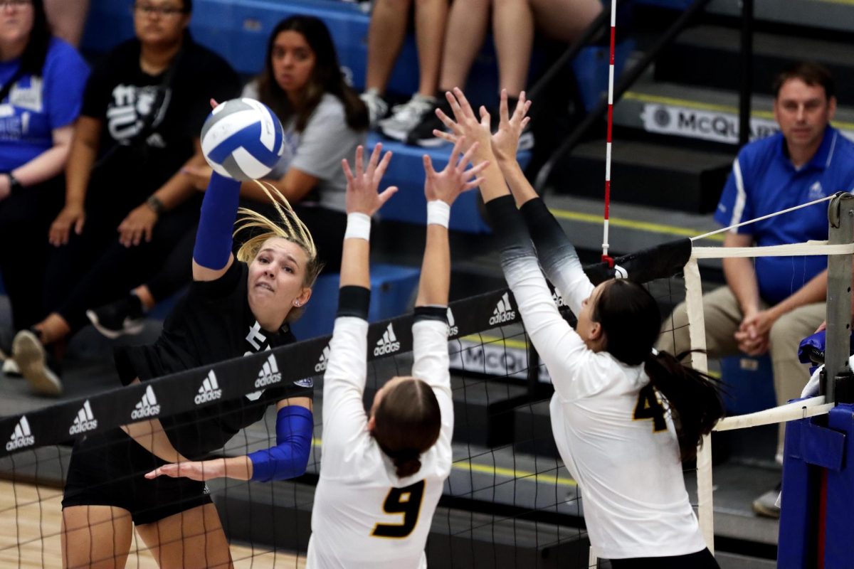 Outside hitter Tori Mohesky hits the ball over the net during the volleyball game against the University of Missouri Tigers Friday afternoon at Lantz Arena. The Panthers lost 3-1. Mohesky had one kill and two points. 