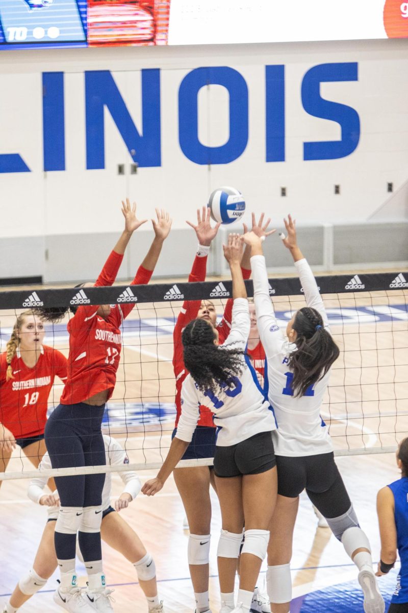 Outside Hitter Giovana Larregui López (15), and Outside Hitter Kaitlyn Flynn (11) both attempt to score a point against University of Southern Indiana Eagles at Lantz Arena Monday Night.